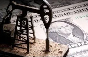 Oil pump jack in the foreground with a U.S. dollar bill in the background, suggesting a link between oil and money or oil prices.